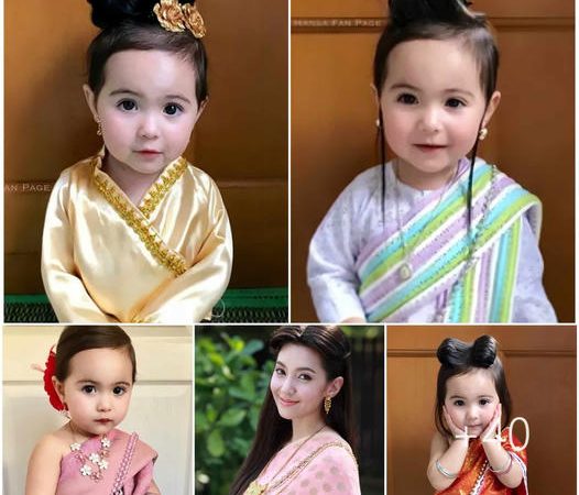 Captivating the World: 2-Year-Old Eurasian Beauty Shines in Traditional Attire